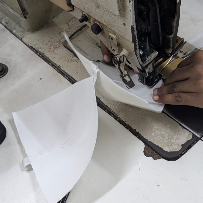 Home stitching the panels of caps stitching of cap custom caps manufacturer India bulk caps supplier India promotional caps manufacturer customized caps with logo