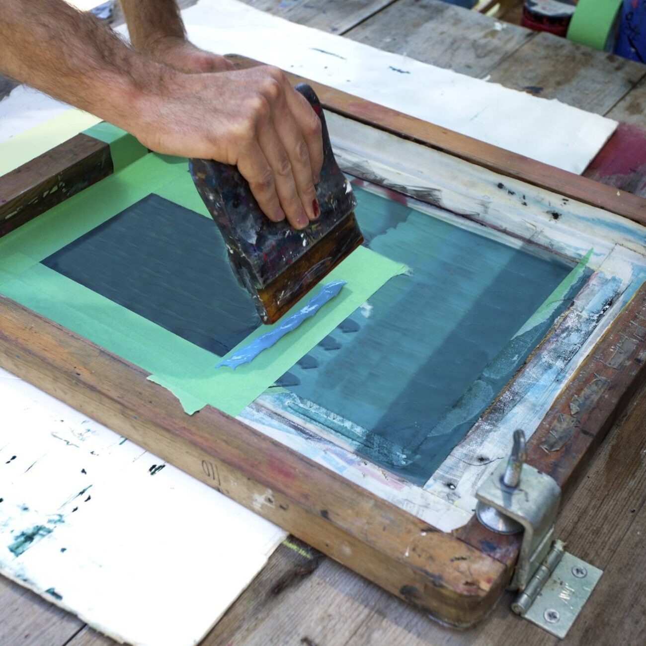 Home photo of artist working on screen printing